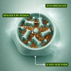 Showcasing the features of a green slow feeder dog bowl with bone-shaped maze pattern.