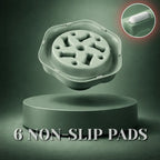 Green slow feeder dog bowl with bone-shaped maze pattern, highlighting its non-slip pad and detailed texture on a dark green background.